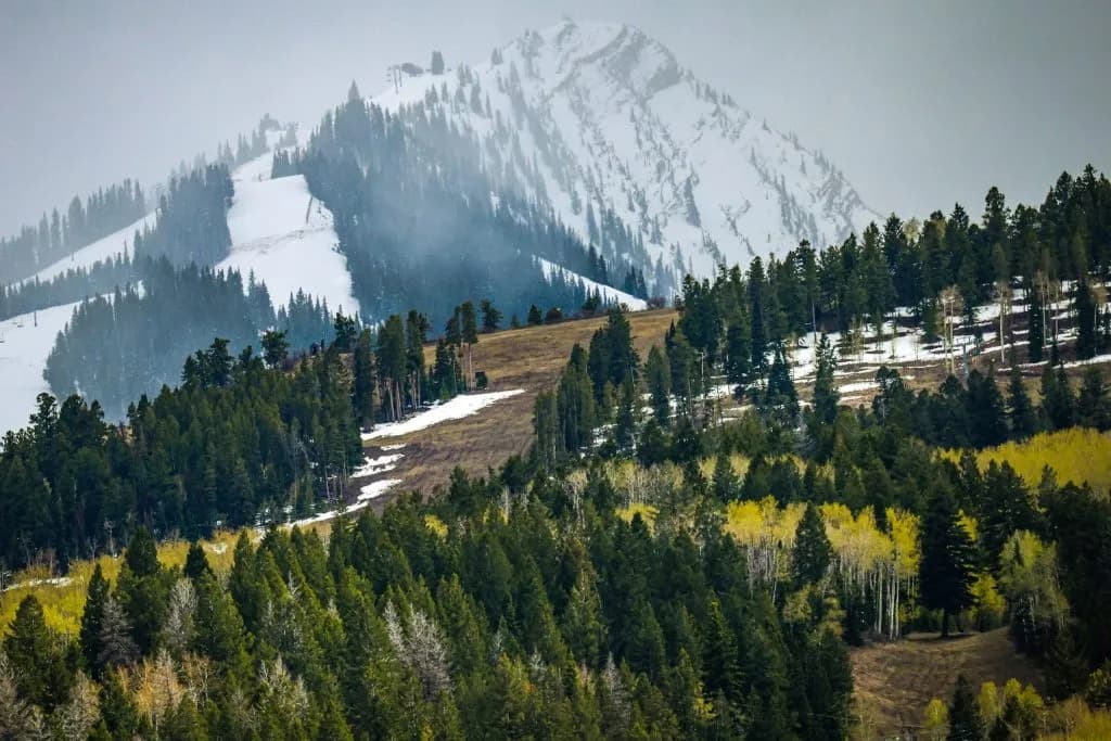 Colorado Peaks See First Snow Caps as Monsoon Rain Arrives