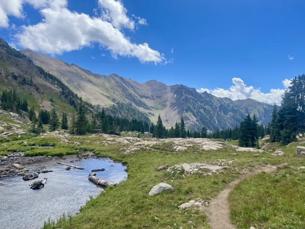 Hikers Climb Pitkin Trail to Alpine Lake in East Vail