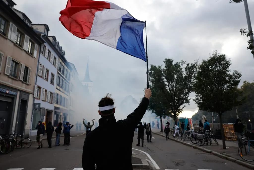 410,000 Protesters Force Tear Gas in Paris Against Macron
